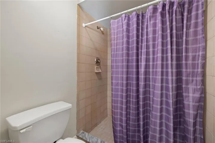 Bathroom featuring walk in shower