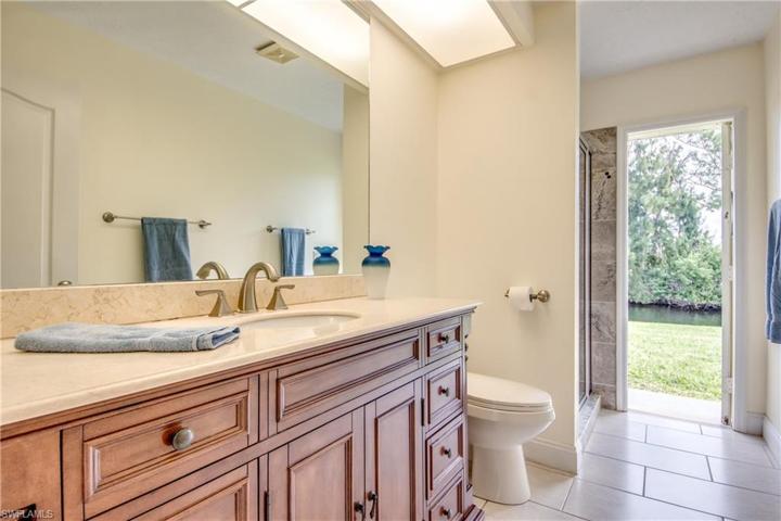 Guest bathroom with updated shower will also serve as a pool bath once you add a pool to this beautiful home.