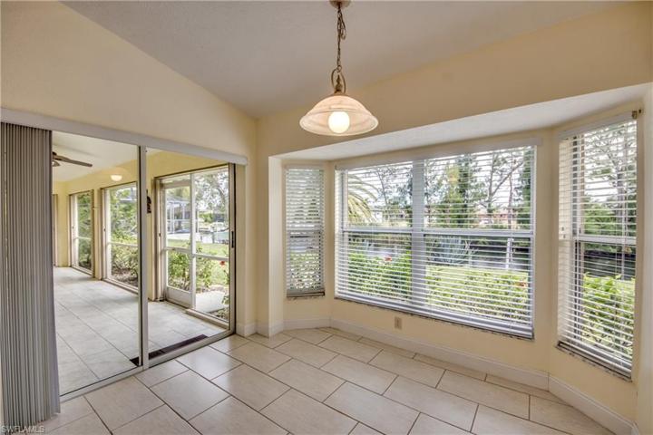 Breakfast nook overlooking canal with slider access to lanai.