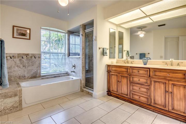 Master bath features a dual vanity, soaker tub & walk-in shower.