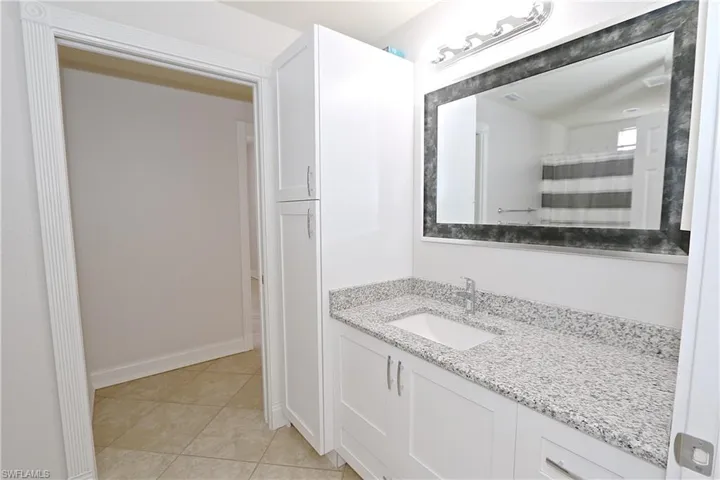 Bathroom featuring vanity and tile patterned floors