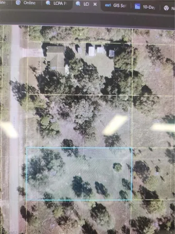 Aerial map of property and surrounding area with property parcel outlined