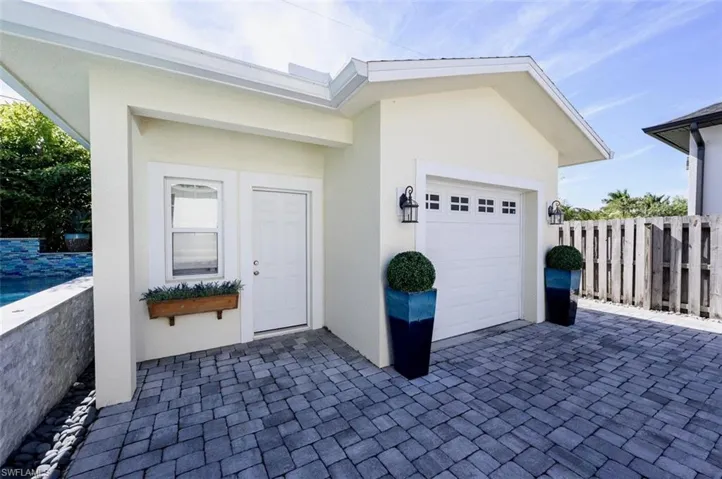 Detached garage, behind gated fence