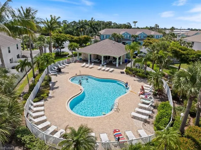 Pool featuring a patio area and fence