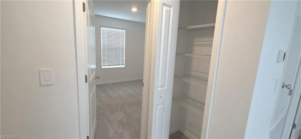Hallway linen closet and bedroom