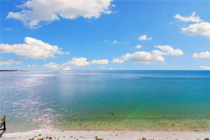 Access the sand from the fishing pier during low tide