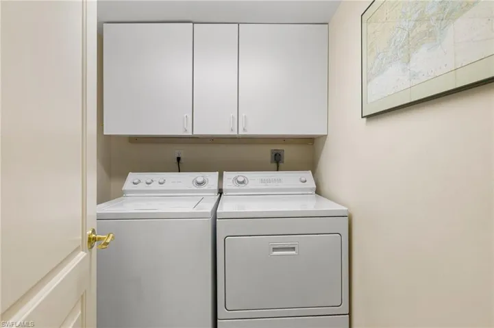 Separate laundry room with storage