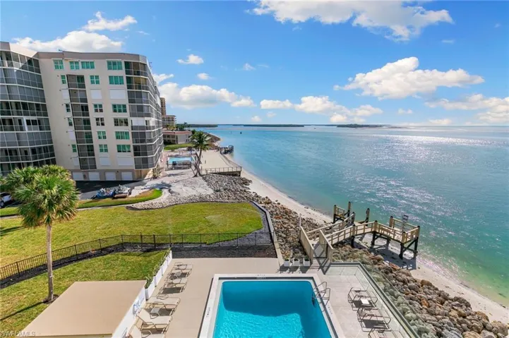 View from lanai overlooking the pool (Landscaping and fishing pier will be completed, see remarks)