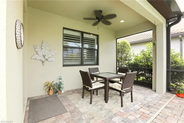 View of patio / terrace featuring outdoor dining area and a ceiling fan