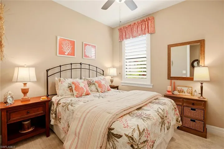 2nd Bedroom featuring light carpet and ceiling fan
