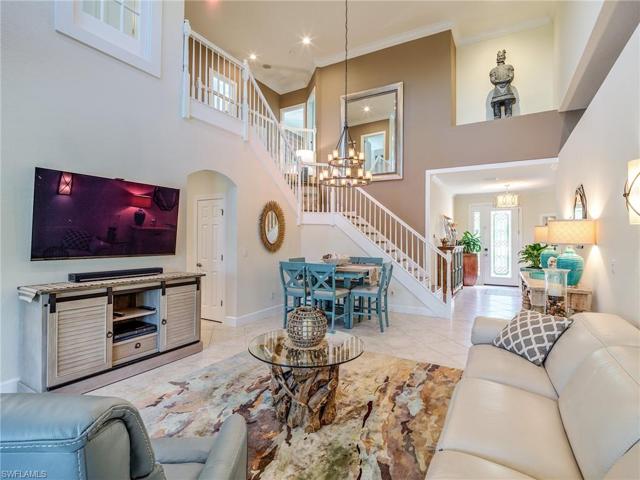 a View from the other side of great room presents the Beautiful Staircase leading to the second floor guest rooms.