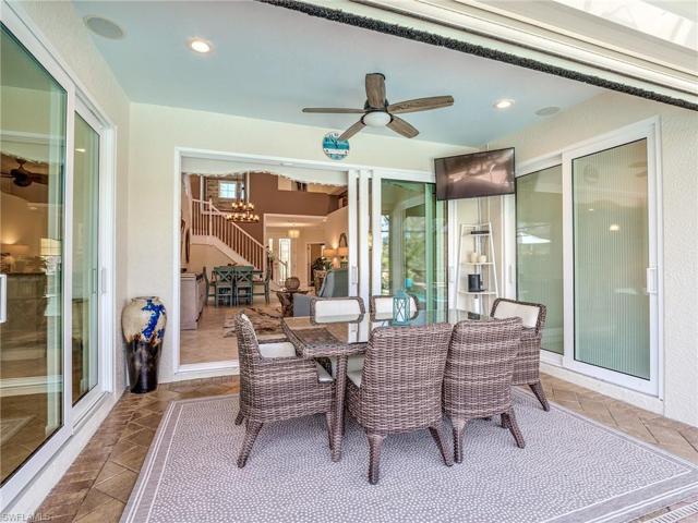 The newer-quality vinyl sliding doors open up the outside to enjoy everything Florida has to offer. This is the covered area closest to the inside living area and easily accessible to the kitchen.