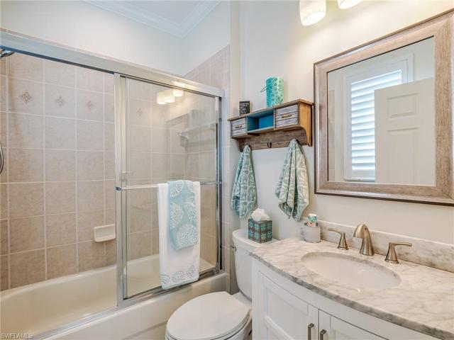 Guest ensuite bathroom has both Tub and shower, upgraded cabinet and sink with matching faucets and mirror