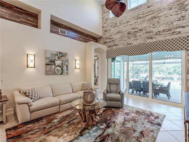 The unique wall accent adds to the amazing view to the lanai, pool, and spa
