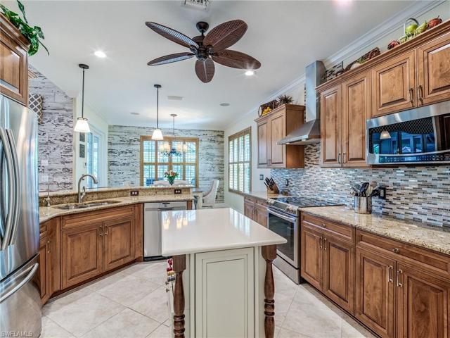 This is a Chefs Delight, 42" Raised panel Cabinets, matching plantation Shutters, great Breakfast area, the SS Hood Vents to the Outside, Quality SS Appliances, Granite counterops, Beautiful Backsplash