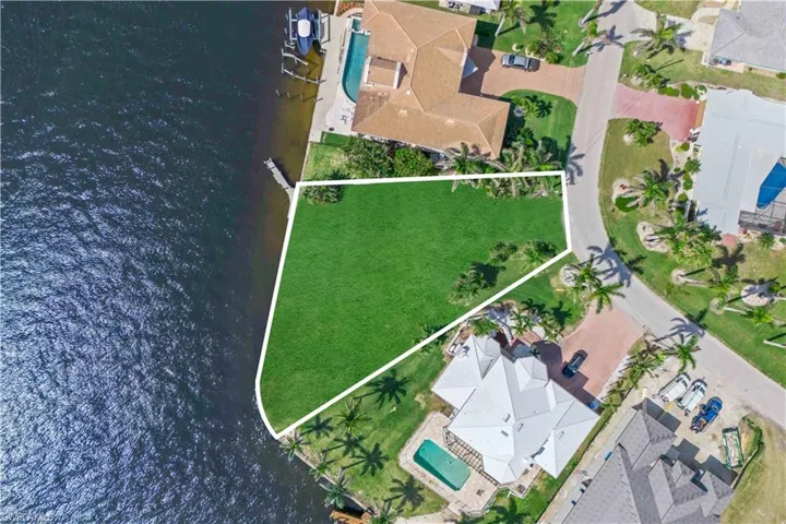 A rare unicorn lot with sweeping views of the Caloosahatchee River and oversized canal access.