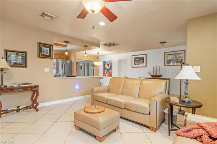 Tiled living room with ceiling fan