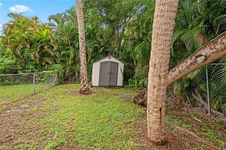 View of yard with a storage shed