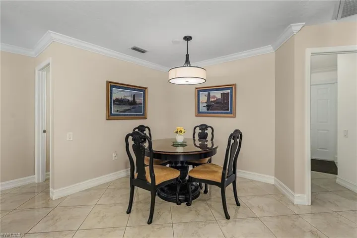 Dining area with crown molding