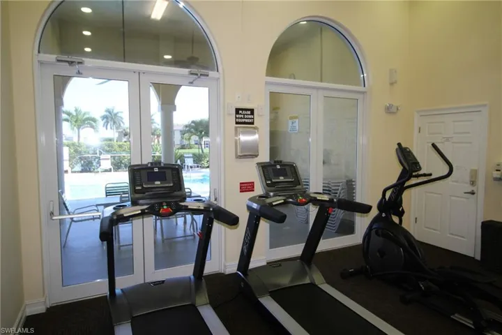 Workout area featuring french doors