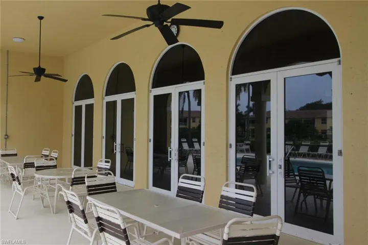 View of patio featuring french doors and ceiling fan