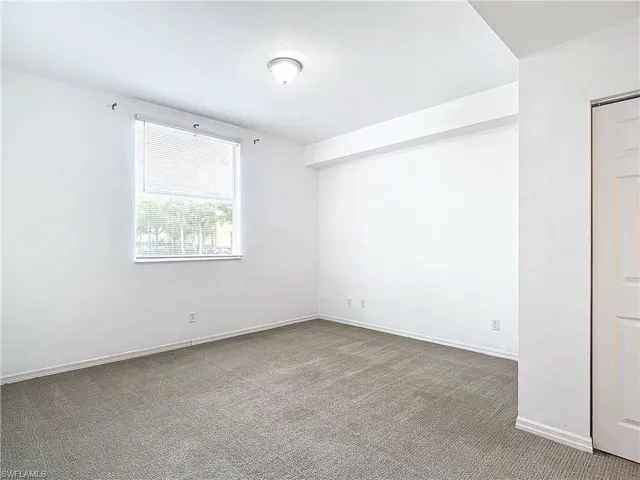Spare room with carpet floors