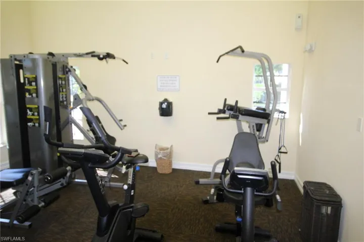 Workout room featuring carpet flooring