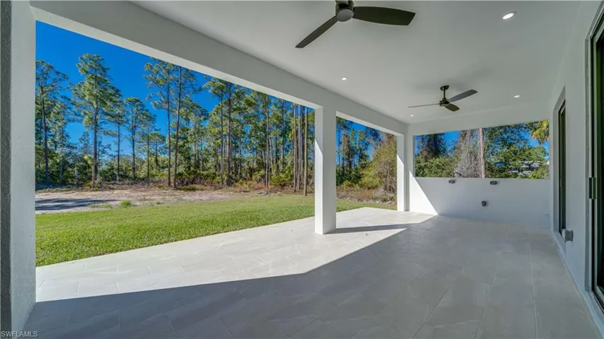 Large open lanai with tile flooring.