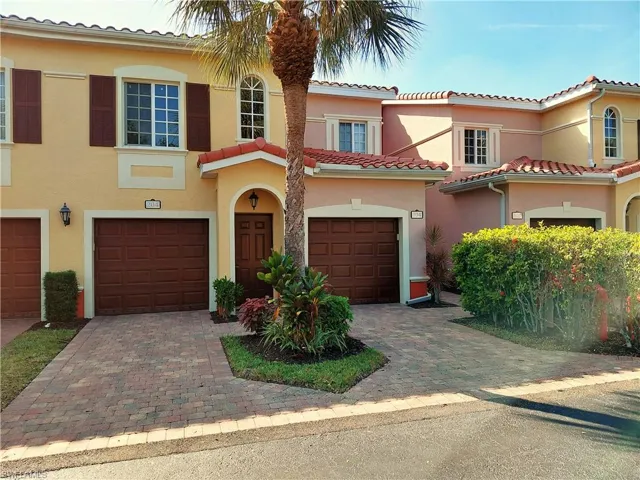 Mediterranean / spanish-style home featuring stucco siding, decorative driveway, and a tiled roof