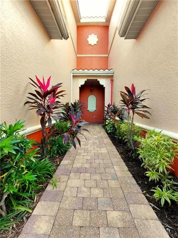 Property entrance featuring stucco siding