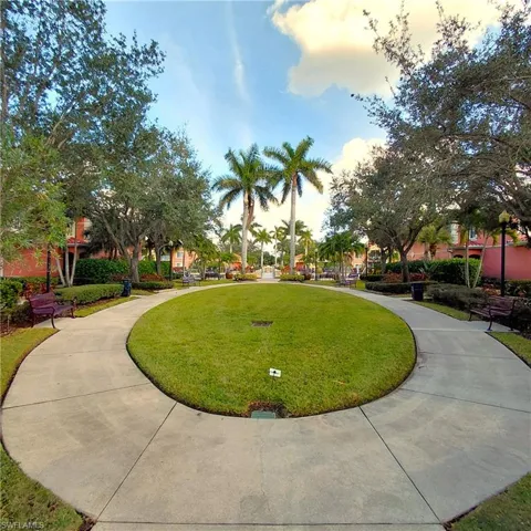 View of property's community featuring a lawn