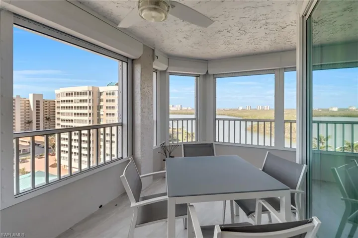 Main lanai wraps around two sides, featuring views of both the Gulf and canal. Watching boats come and go is beautiful!