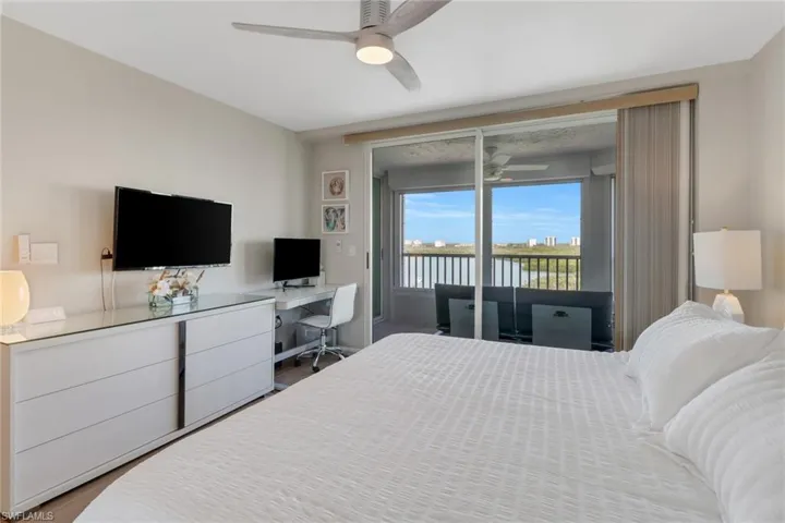 Guest bedroom with private lanai overlooking canal.