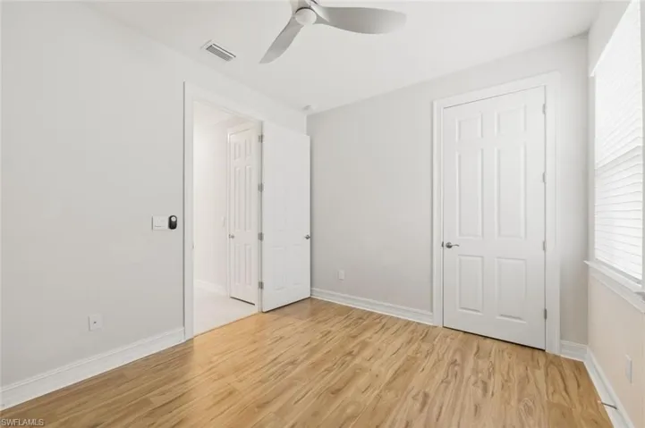Unfurnished bedroom featuring light wood-style floors and ceiling fan