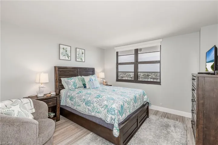 Bedroom featuring baseboards and light wood-type flooring