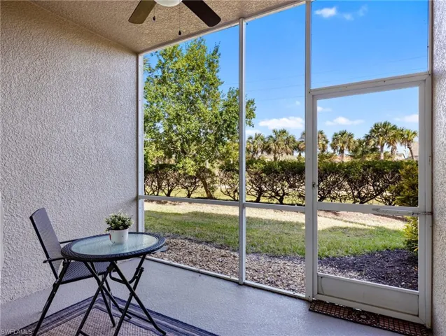Unfurnished sunroom with ceiling fan