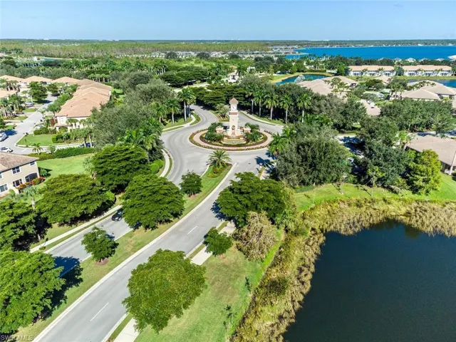Drone / aerial view with a water view and a residential view