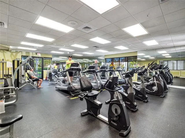 Gym with a drop ceiling and visible vents