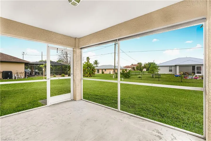 Unfurnished sunroom with a residential view
