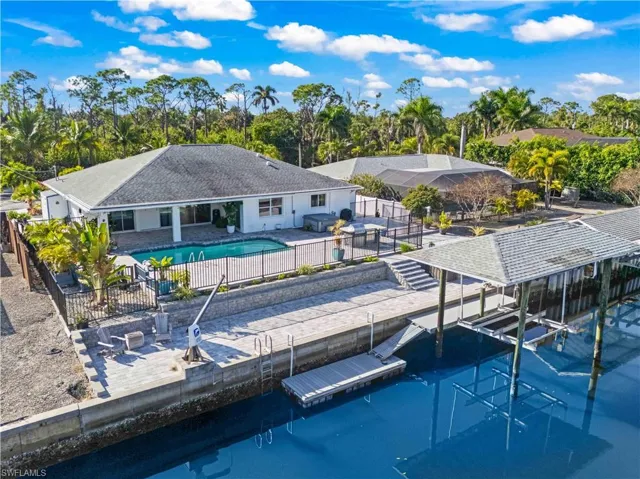 Boater’s paradise featuring wide canal frontage, covered lift, and easy launch for paddleboards and kayaks.
