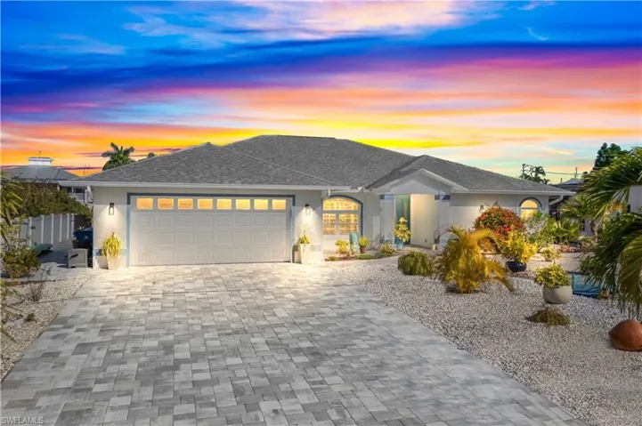 Striking curb appeal with an oversized lot, extended driveway, rare convenience in paradise.