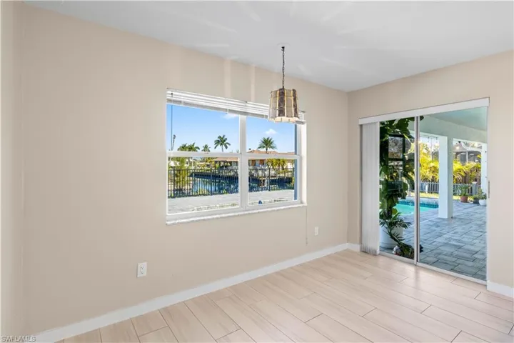 Bright breakfast nook with direct views of the canal, perfect for morning coffee or casual meals.