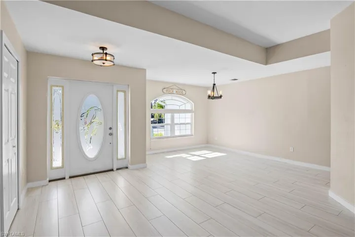 A simple, elegant entryway that flows seamlessly into the main living & dining area.