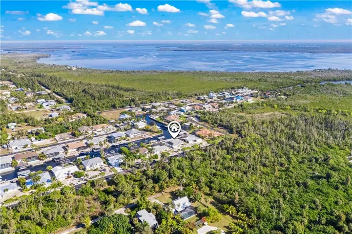 Moments from boating, waterfront dining, marinas, and a scenic 17-mile pathway, this residence offers the quintessential Pine Island lifestyle.