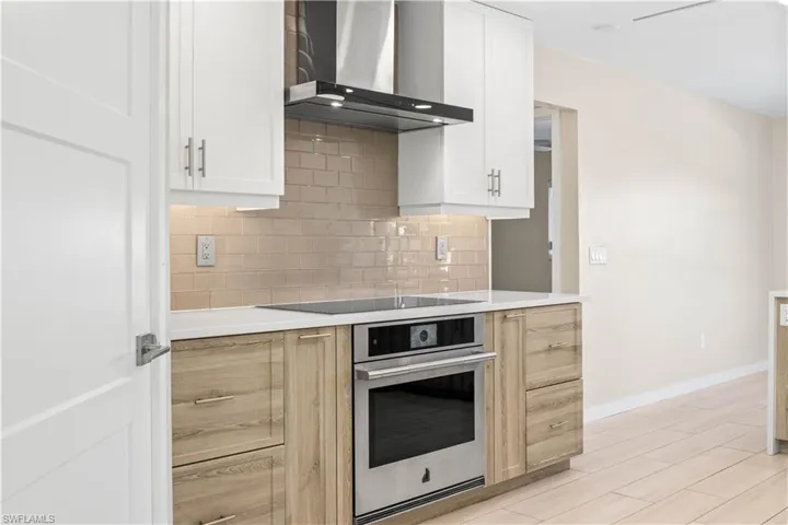 Sleek, modern vent hood seamlessly integrated into the chef’s kitchen design.