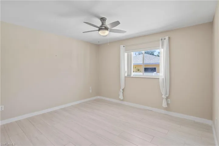 Guest bedroom with easy access to shared bathrooms and common living areas.