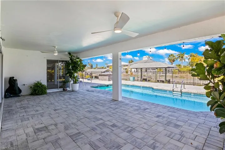 An exquisitely designed alfresco sanctuary—fully pavered, maintenance-free, and curated for refined coastal entertaining.