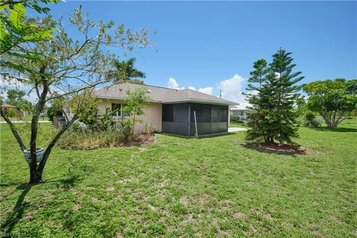 View of yard featuring a sunroom