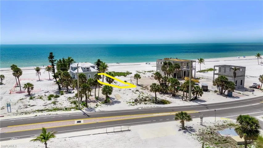 Property view of water featuring a view of the beach  - Virtually Edited Image