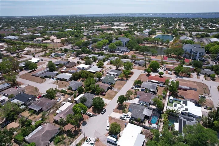 Drone / aerial view featuring a water view and a residential view